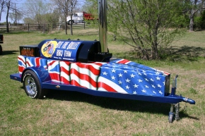 The 15 foot barbecue with wheels, and covered in British and American flags